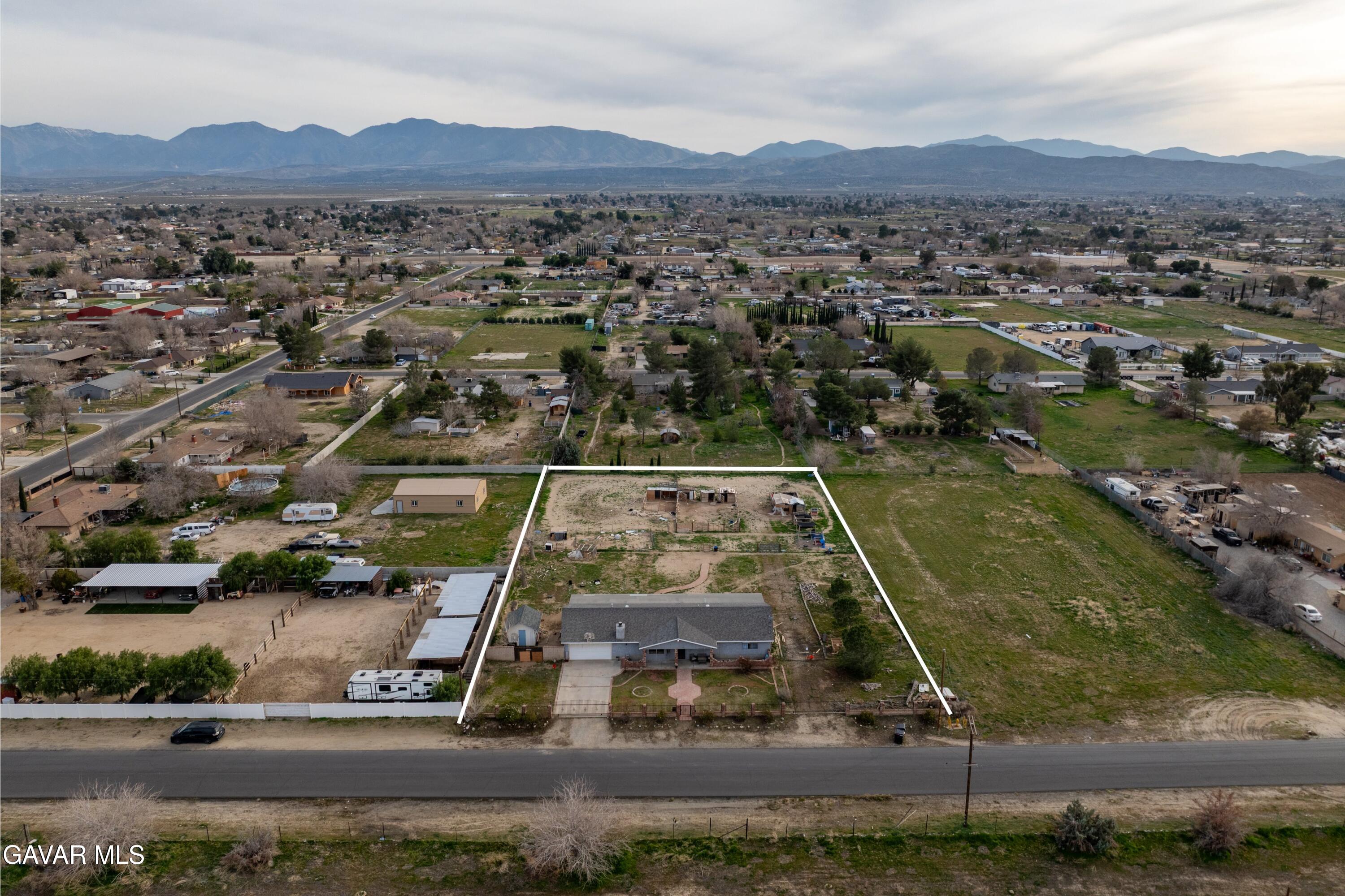 9340 East Ave R 10 Littlerock, CA 93543 - Photo 25 of 33 an aerial view of residential houses with outdoor space and parking