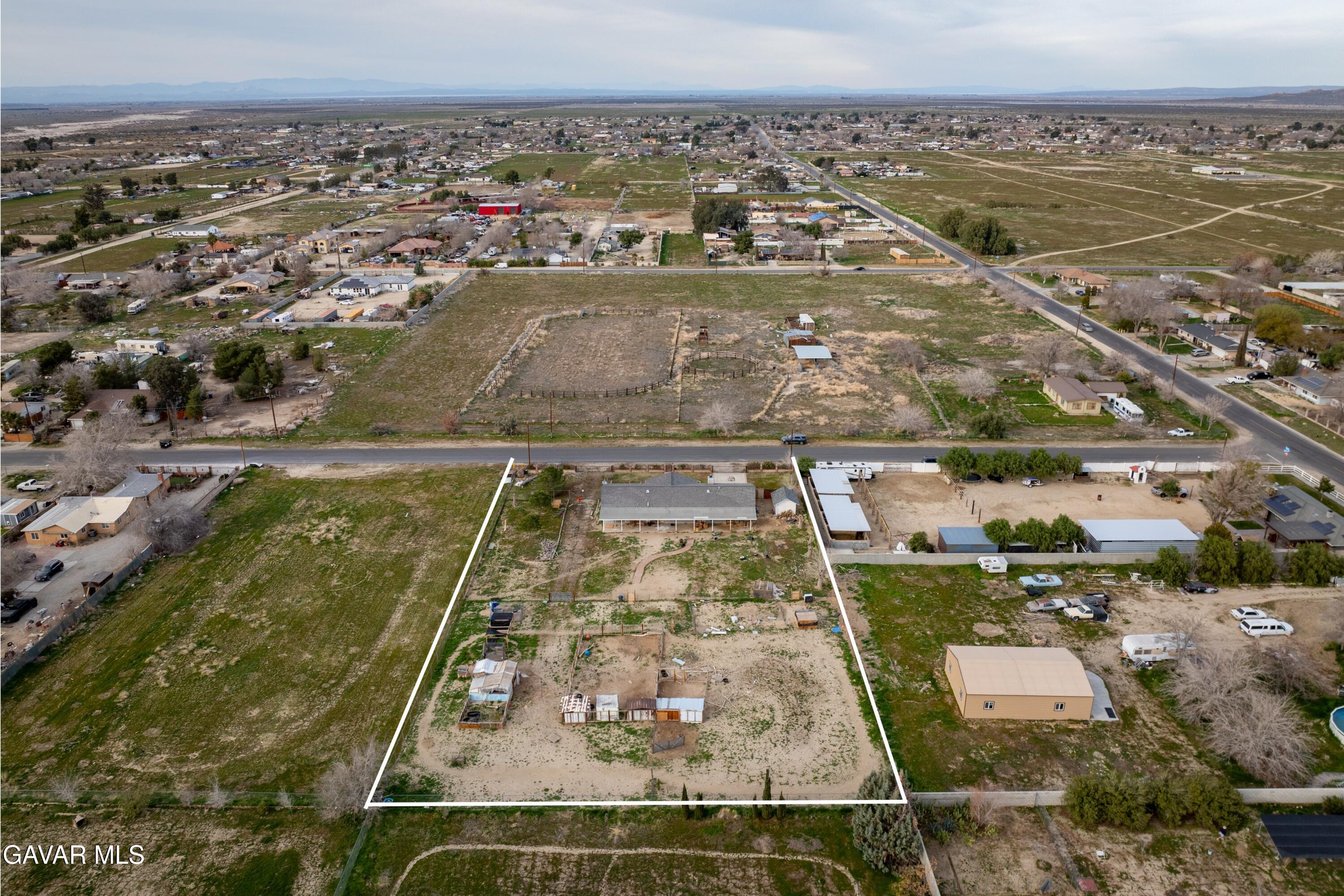 9340 East Ave R 10 Littlerock, CA 93543 - Photo 27 of 33 an aerial view of residential houses with outdoor space