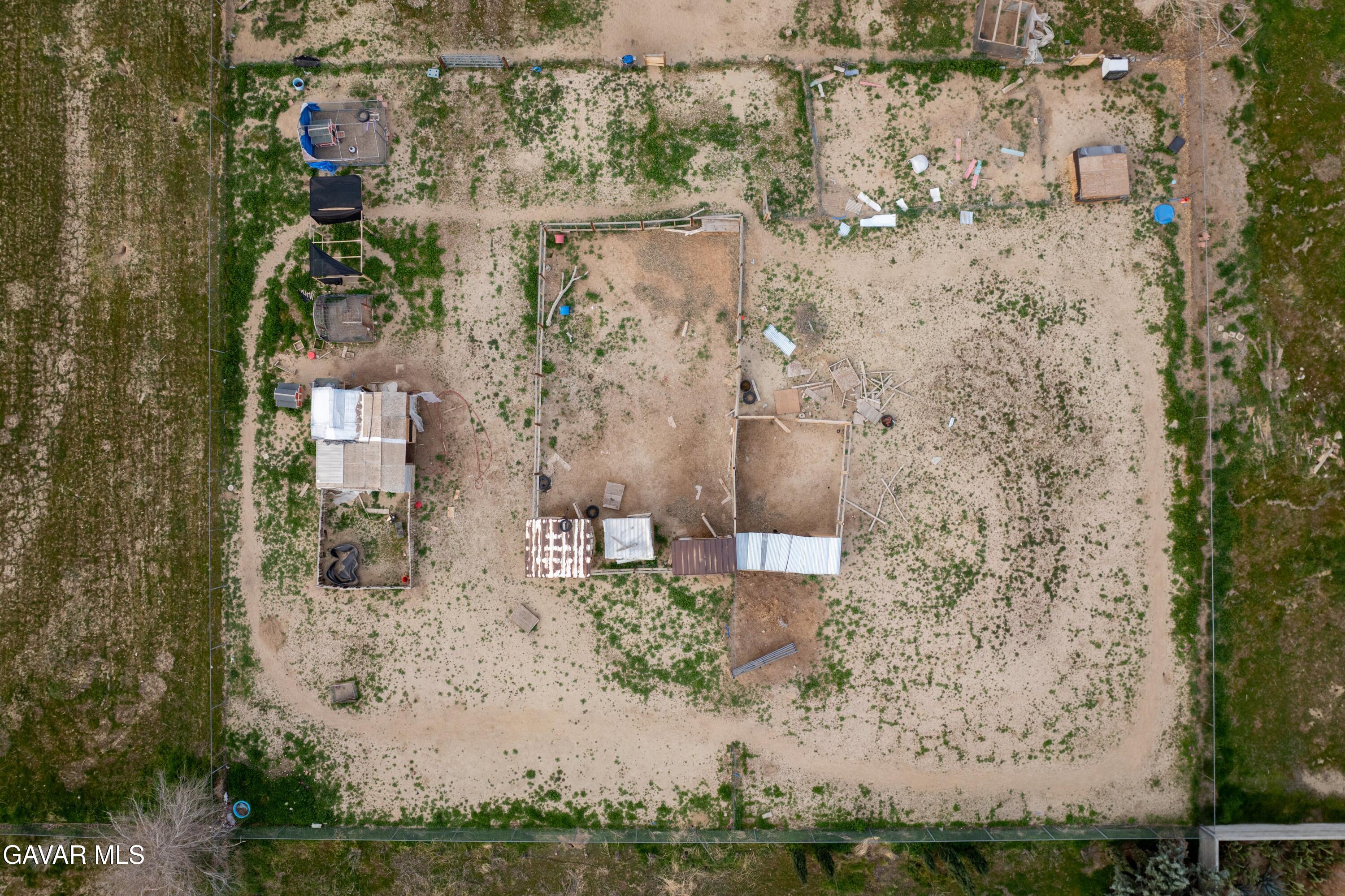 9340 East Ave R 10 Littlerock, CA 93543 - Photo 29 of 33 a aerial view of a house with a yard and large trees