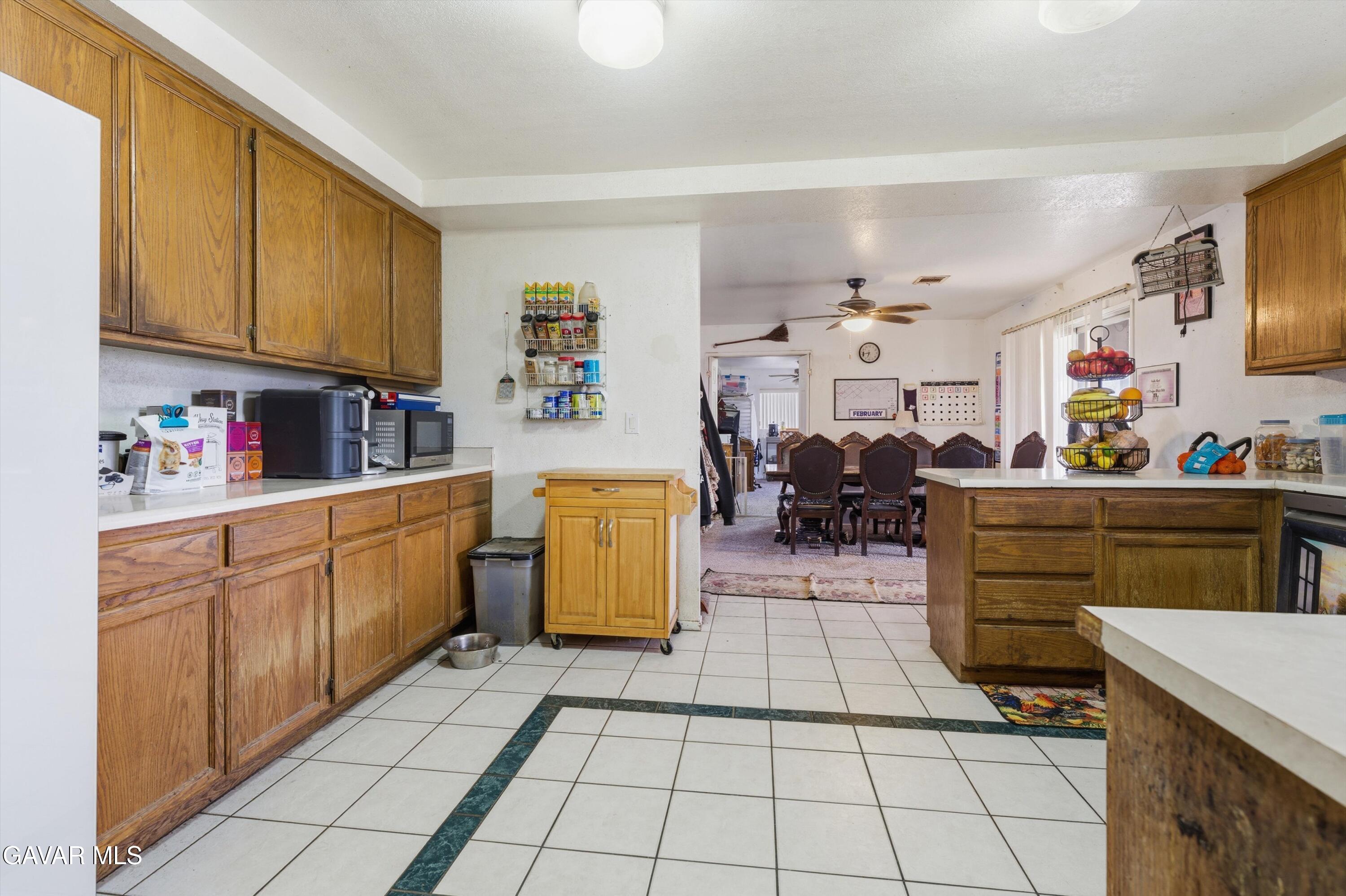 9340 East Ave R 10 Littlerock, CA 93543 - Photo 6 of 33 a kitchen with sink cabinets and appliances