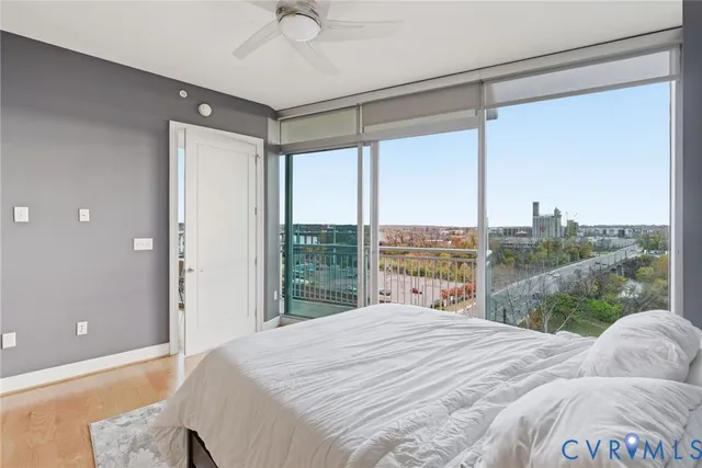 a bedroom with a large bed and a large window