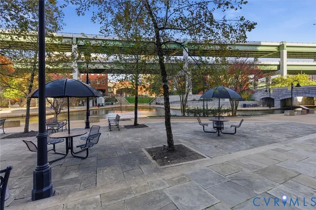 a view of a patio with table and chairs and potted plants