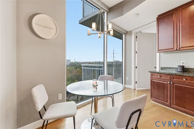a view of a dining room with furniture window and wooden floor