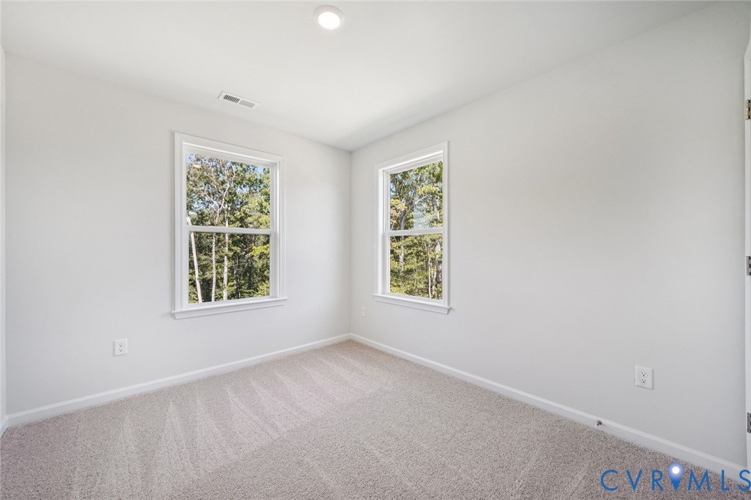 340 Mt Mccauley Way Aylett, VA 23009 - Photo 12 of 48 an empty room with a window