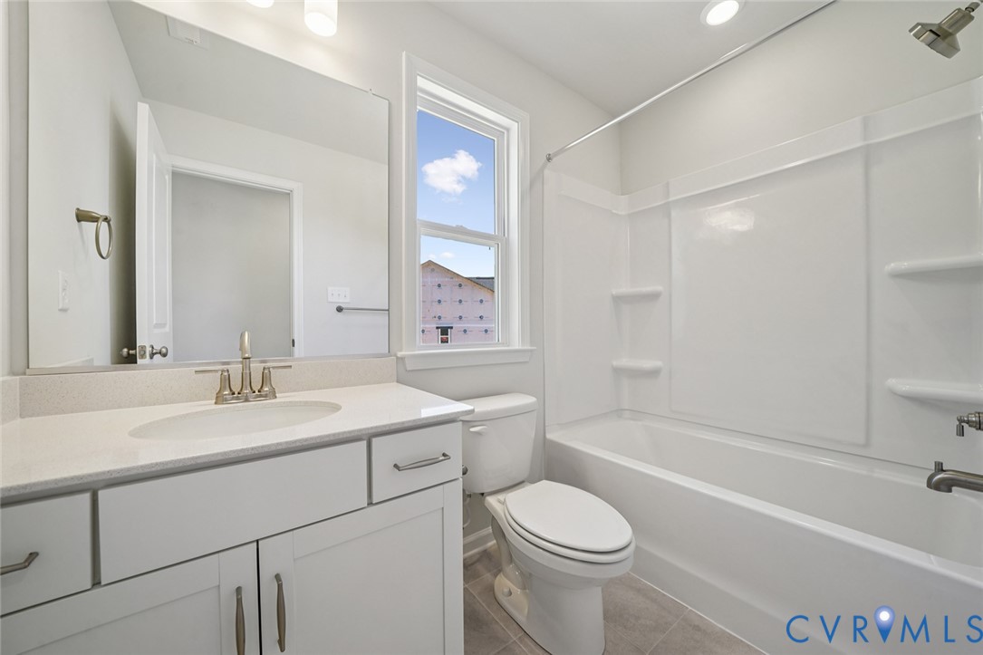 340 Mt Mccauley Way Aylett, VA 23009 - Photo 17 of 48 a bathroom with a sink a toilet and a bathtub