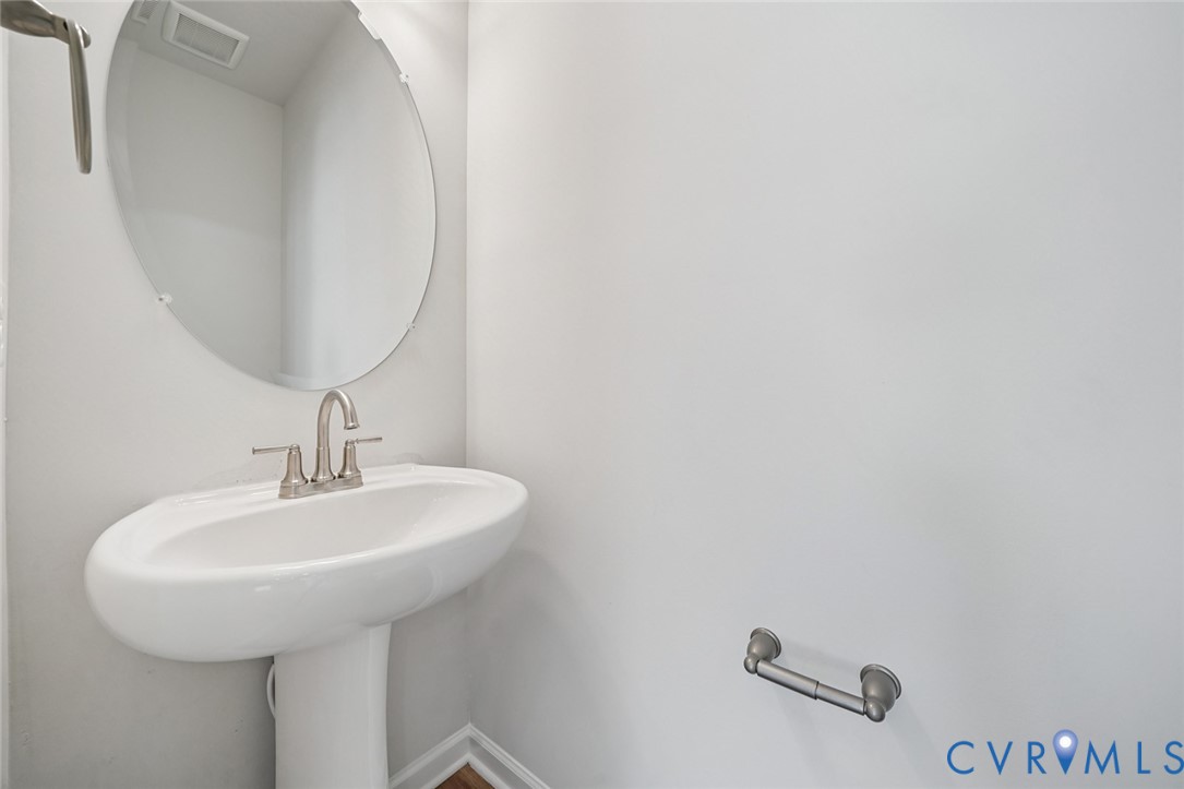 340 Mt Mccauley Way Aylett, VA 23009 - Photo 9 of 48 a bathroom with a sink and a mirror