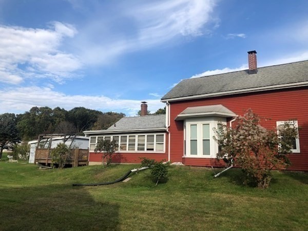 218 Granby Road Chicopee, MA 01013 - Photo 1 of 21 a front view of house with yard and green space