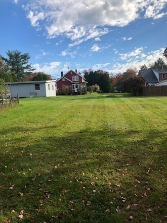 218 Granby Road Chicopee, MA 01013 - Photo 14 of 21 a view of a big yard with a house in the background