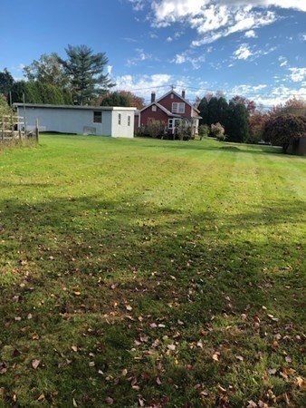 218 Granby Road Chicopee, MA 01013 - Photo 15 of 21 a view of a big yard with a house