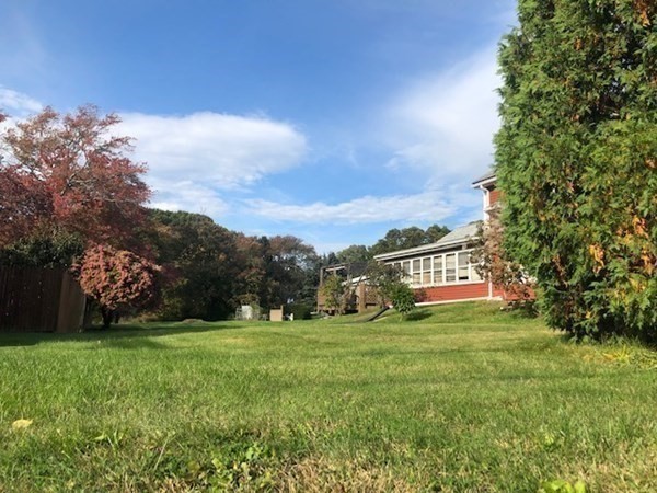 218 Granby Road Chicopee, MA 01013 - Photo 8 of 21 a view of a big yard with plants and large trees