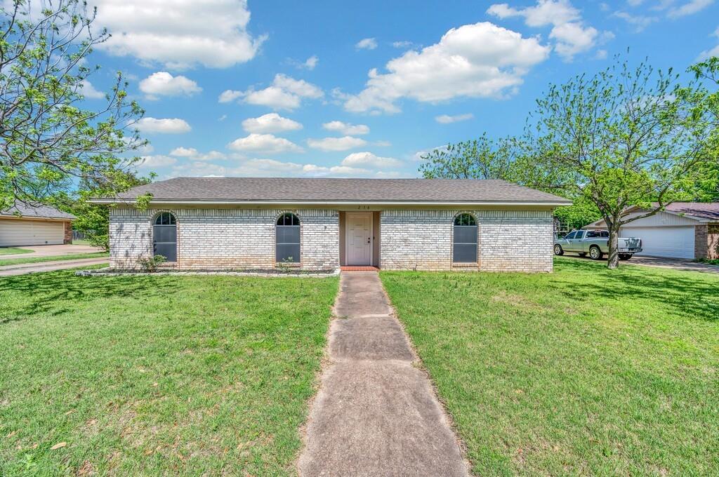 front view of a house with a yard