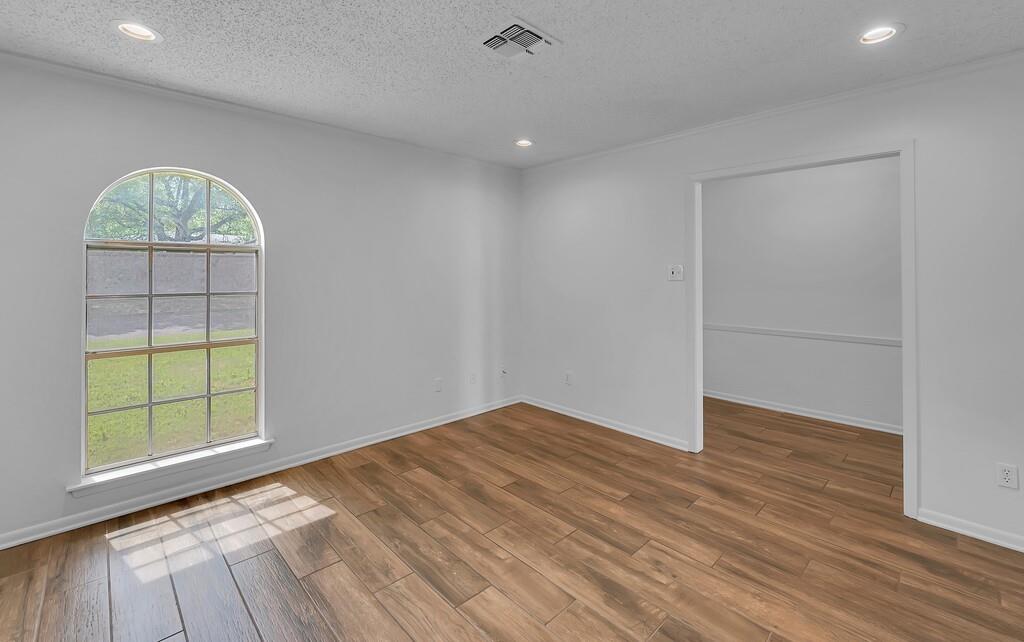 216 Texas Avenue Hewitt, TX 76643 - Photo 14 of 32 wooden floor in an empty room with a window