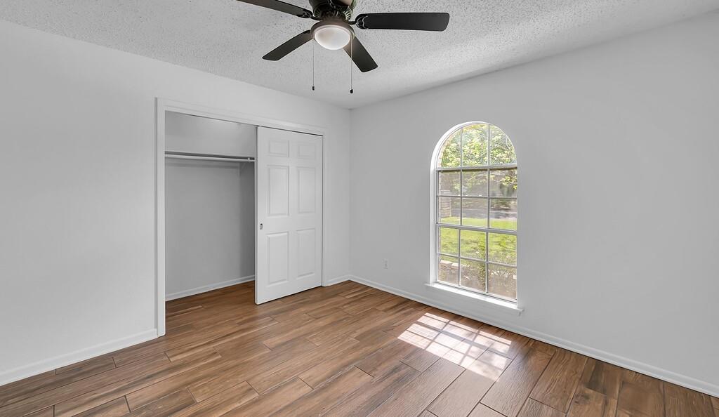 216 Texas Avenue Hewitt, TX 76643 - Photo 21 of 32 wooden floor in an empty room with a window