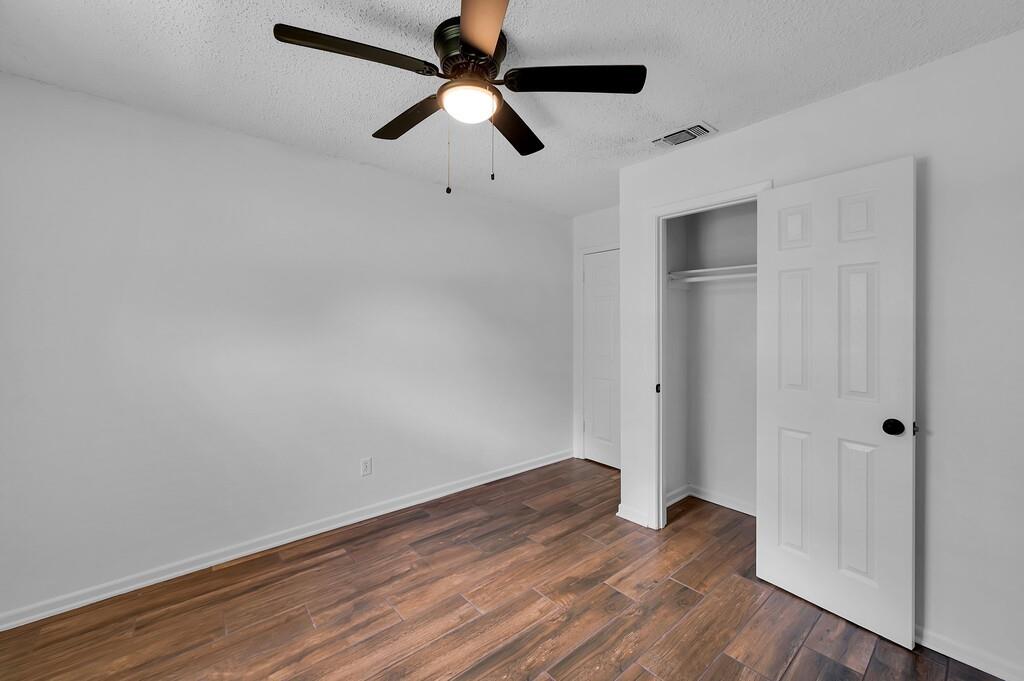 216 Texas Avenue Hewitt, TX 76643 - Photo 24 of 32 wooden floor in an empty room