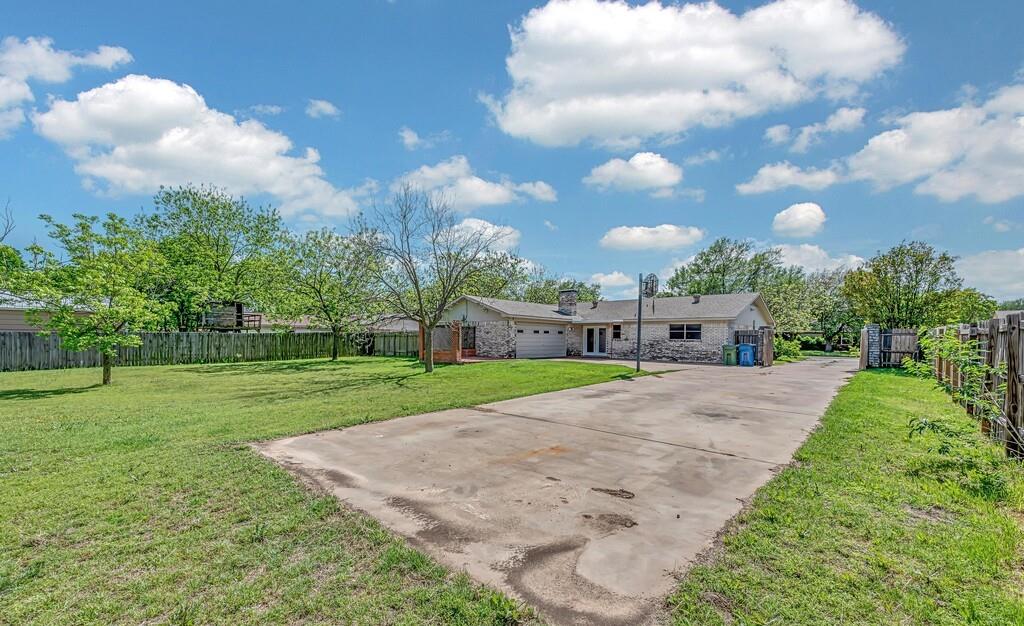 216 Texas Avenue Hewitt, TX 76643 - Photo 29 of 32 a front view of house with yard and trees