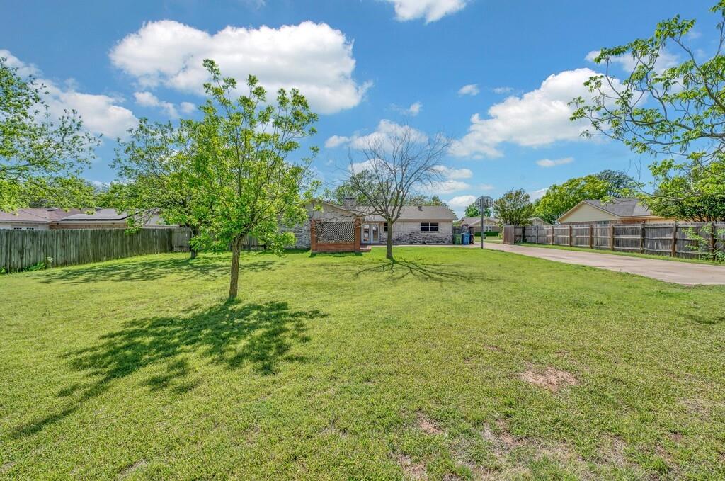 216 Texas Avenue Hewitt, TX 76643 - Photo 30 of 32 a view of a house with a backyard