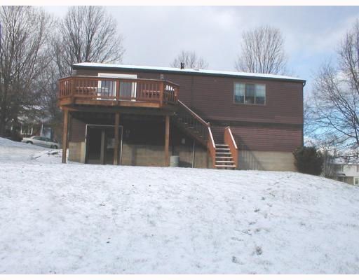 112 Raccoon Way Gibsonia, PA 15044 - Photo 8 of 9 Exterior Back. rear of home showing family room and dining room/deck great rear yard for Your dog, or children to roam or play.could be great area for sled riding???