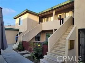 a view of a house with wooden stairs
