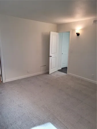 a view of an empty room and window