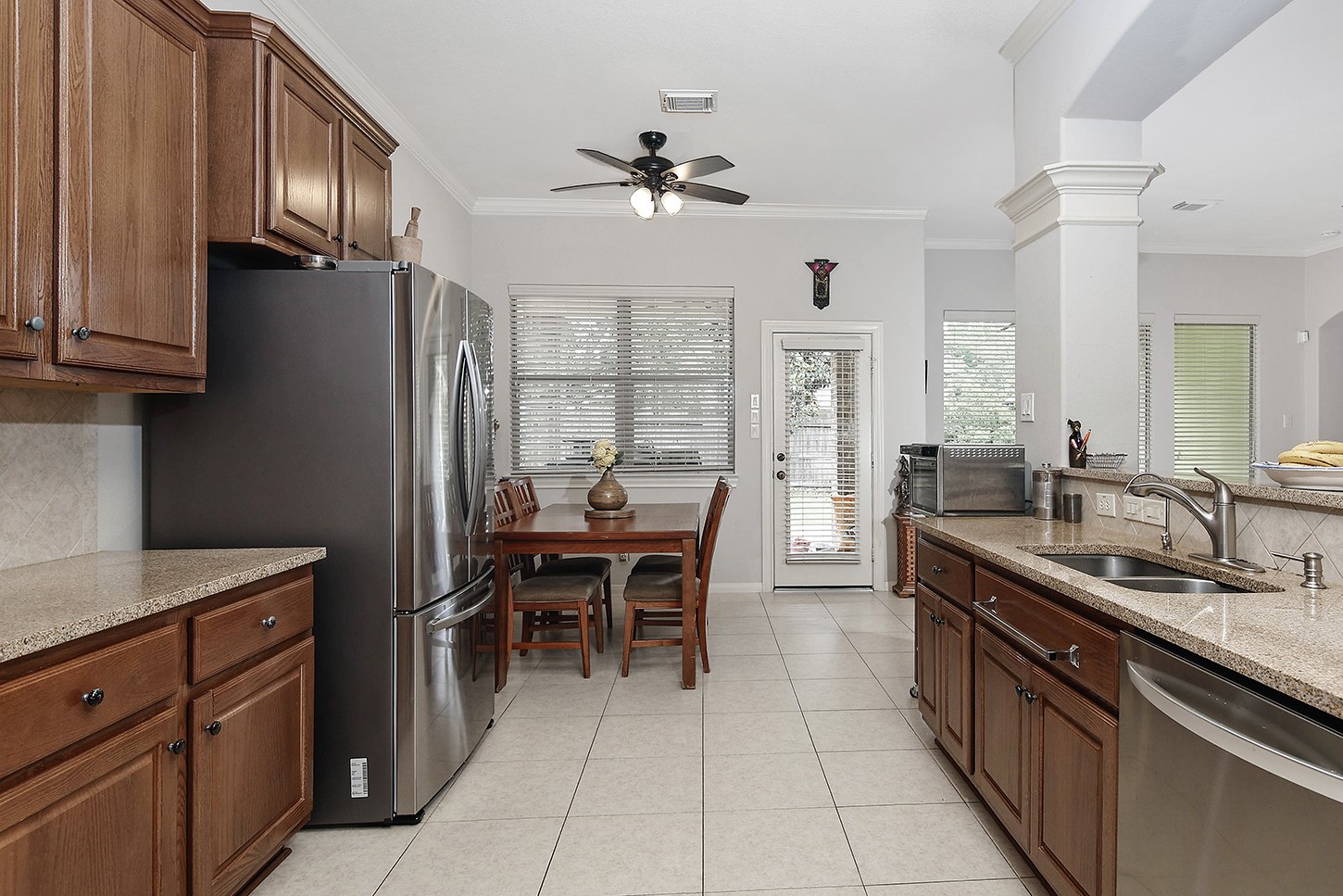 18722 Duke Lake Drive Spring, TX 77388 - Photo 11 of 26 a kitchen with granite countertop a sink stainless steel appliances and cabinets