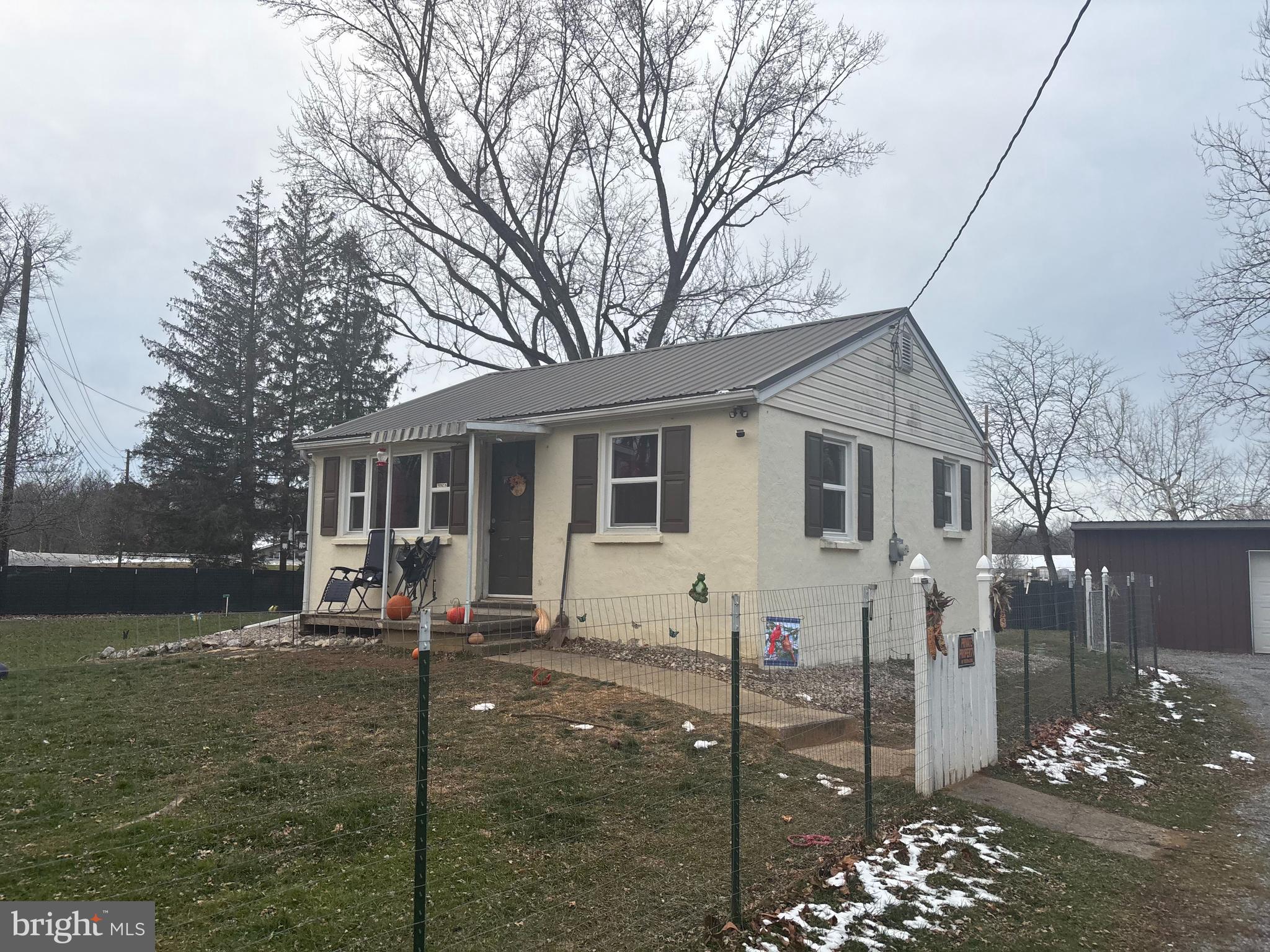 1934 Edgewood Road Chambersburg, PA 17202 - Photo 1 of 8 a front view of a house with garden