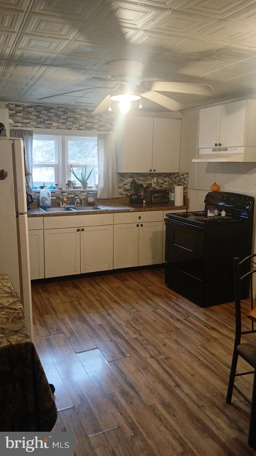 1934 Edgewood Road Chambersburg, PA 17202 - Photo 4 of 8 a kitchen with a sink and cabinets