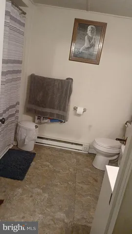 a bathroom with a toilet and a sink
