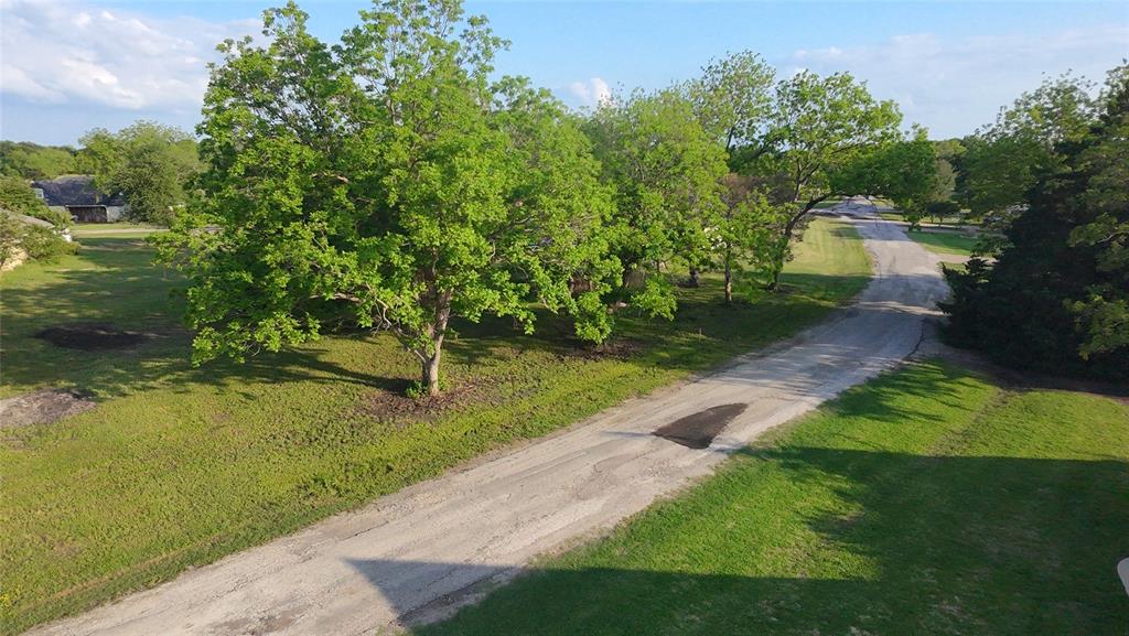 Lot 71 Shoreline Road Kerens, TX 75144 - Photo 13 of 24 a view of a garden with large trees