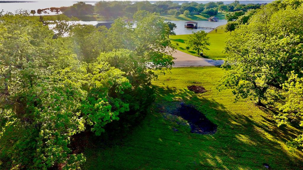 Lot 71 Shoreline Road Kerens, TX 75144 - Photo 19 of 24 a view of a lake with a yard