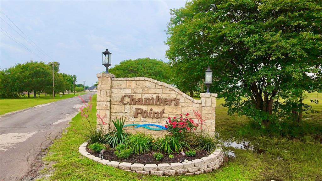Lot 71 Shoreline Road Kerens, TX 75144 - Photo 3 of 24 a view of a garden with plants and large trees