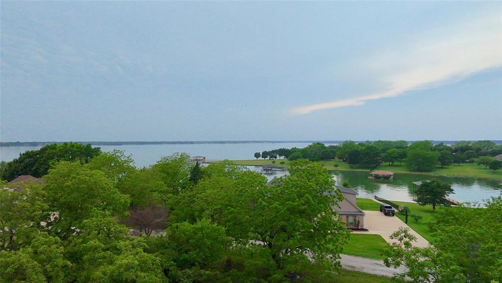 Lot 71 Shoreline Road Kerens, TX 75144 - Photo 7 of 24 a view of a lake with houses in outdoor space