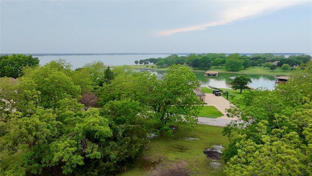 Lot 71 Shoreline Road Kerens, TX 75144 - Photo 8 of 24 a view of a lake with a city