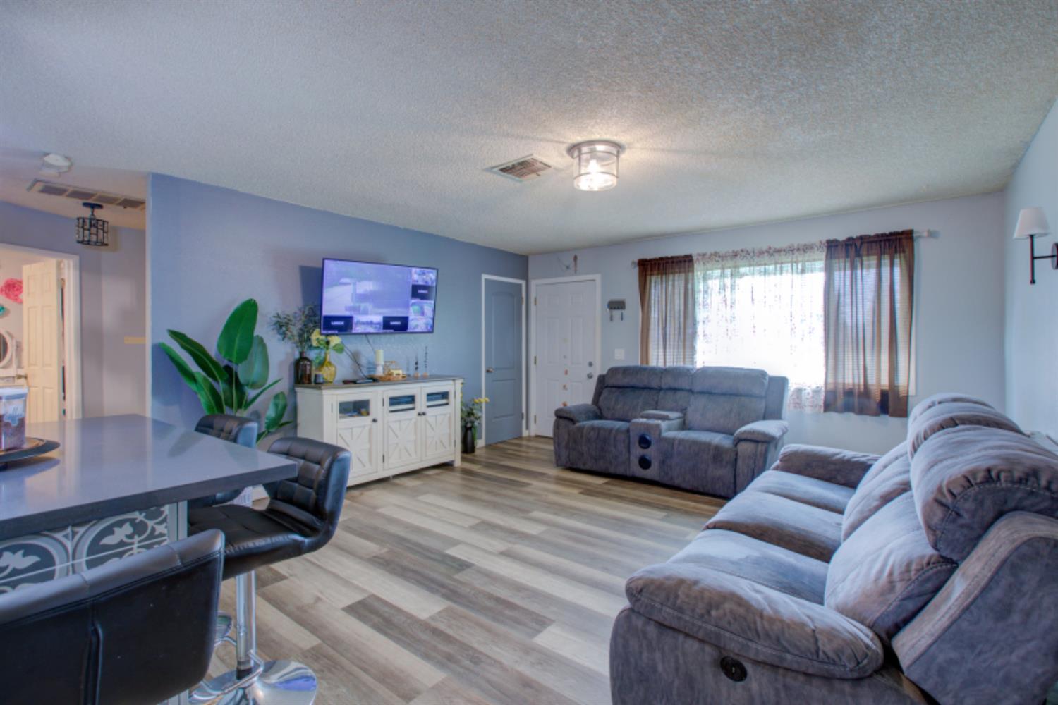 7139 Center Street Winton, CA 95388 - Photo 12 of 36 a living room with furniture and a wooden floor