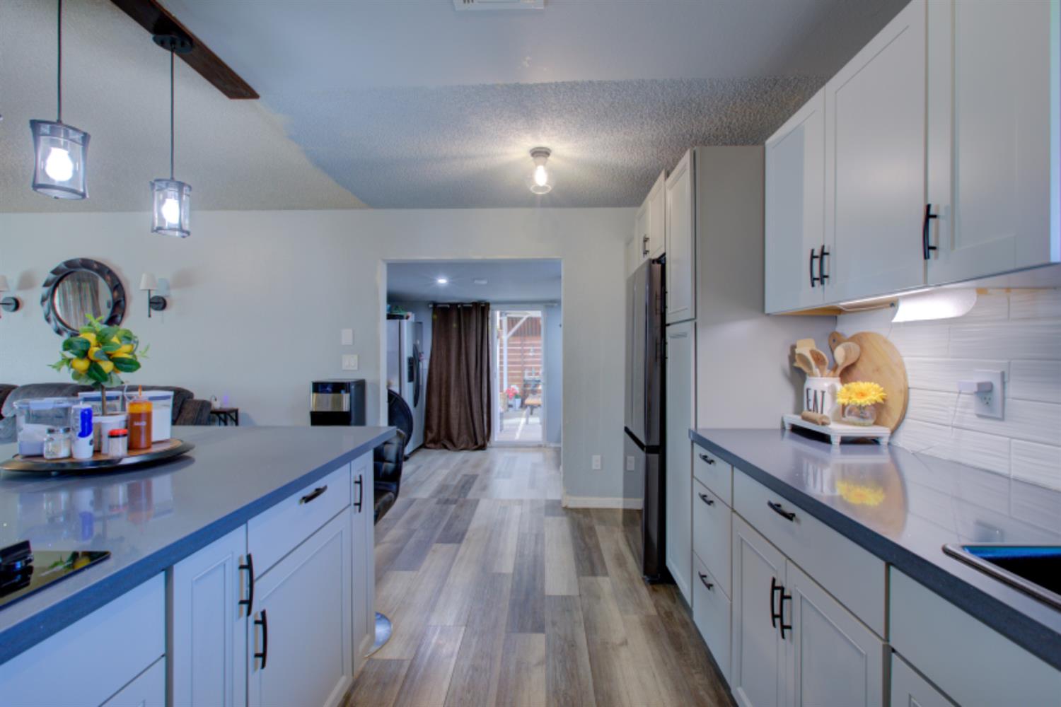 7139 Center Street Winton, CA 95388 - Photo 14 of 36 a kitchen with granite countertop a sink appliances cabinets and counter space