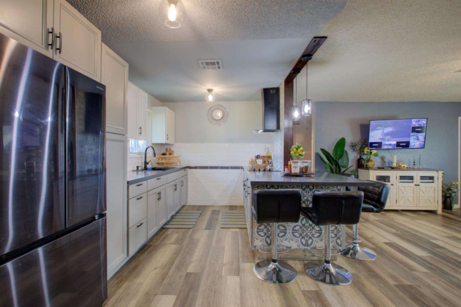 7139 Center Street Winton, CA 95388 - Photo 15 of 36 a large kitchen with lots of counter space and stainless steel appliances