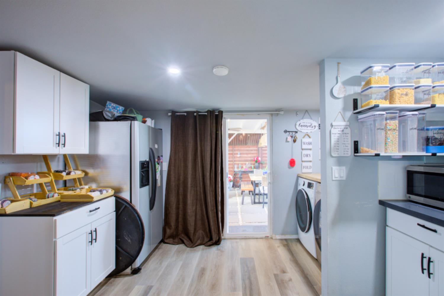 7139 Center Street Winton, CA 95388 - Photo 17 of 36 a kitchen with refrigerator a washer and dryer