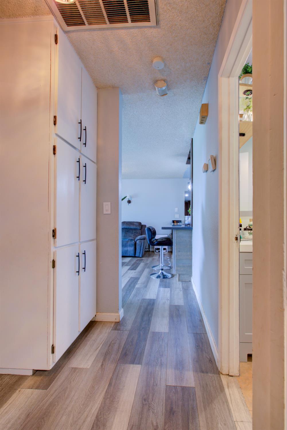 7139 Center Street Winton, CA 95388 - Photo 24 of 36 a view of a hallway view with wooden floor and staircase