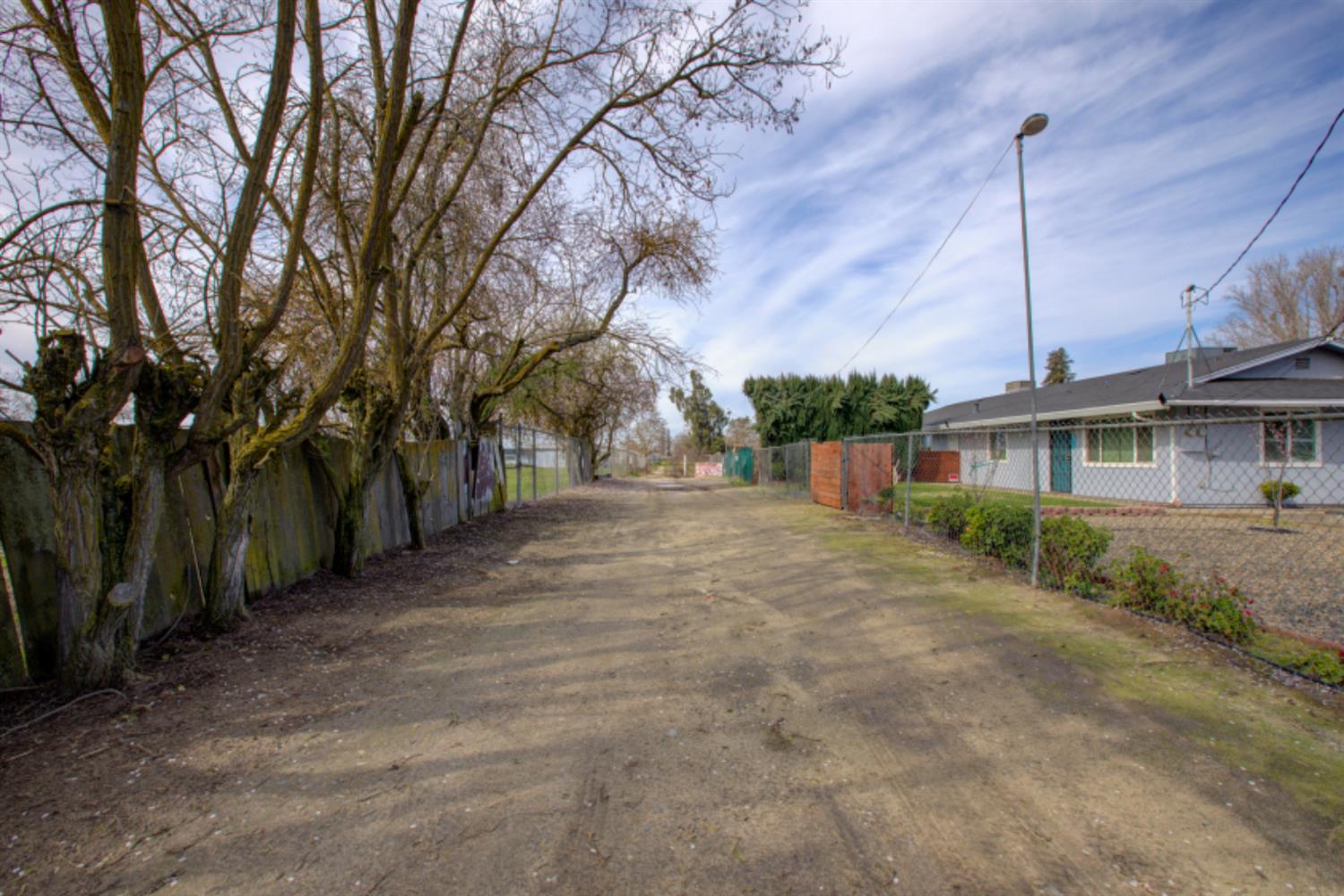 7139 Center Street Winton, CA 95388 - Photo 3 of 36 a front view of a house with a yard and garage