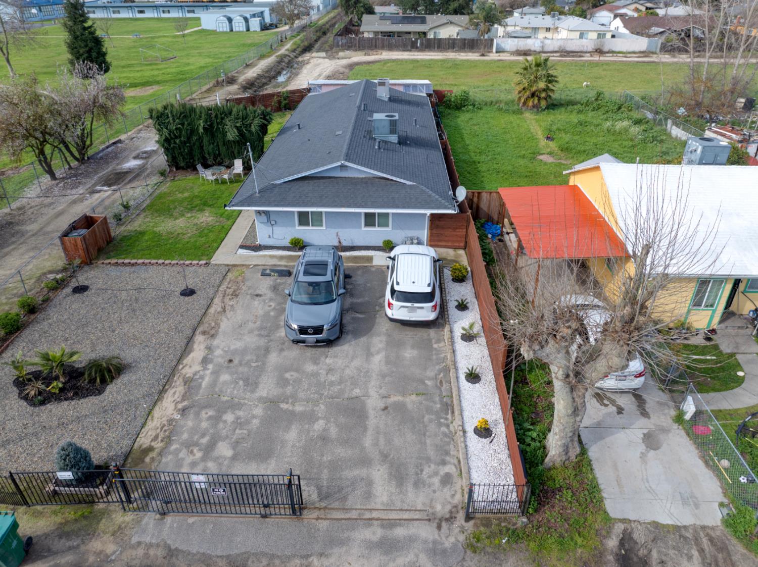 7139 Center Street Winton, CA 95388 - Photo 34 of 36 an aerial view of a house with garden space and street view