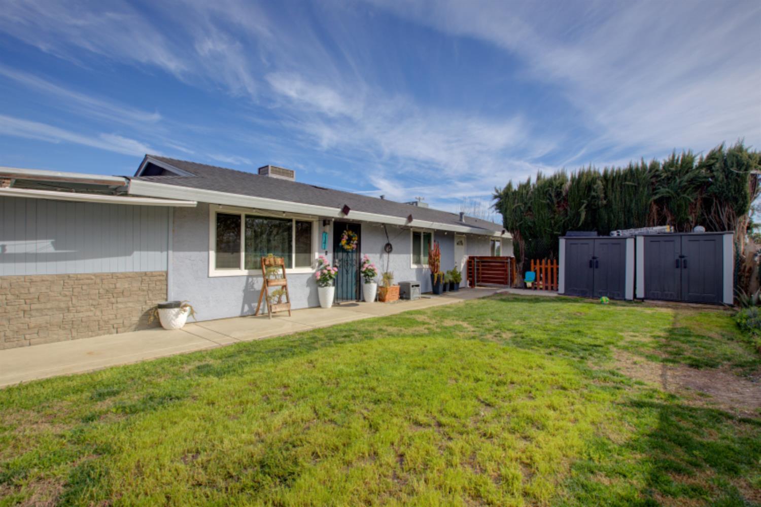 7139 Center Street Winton, CA 95388 - Photo 7 of 36 a front view of house with yard and outdoor seating