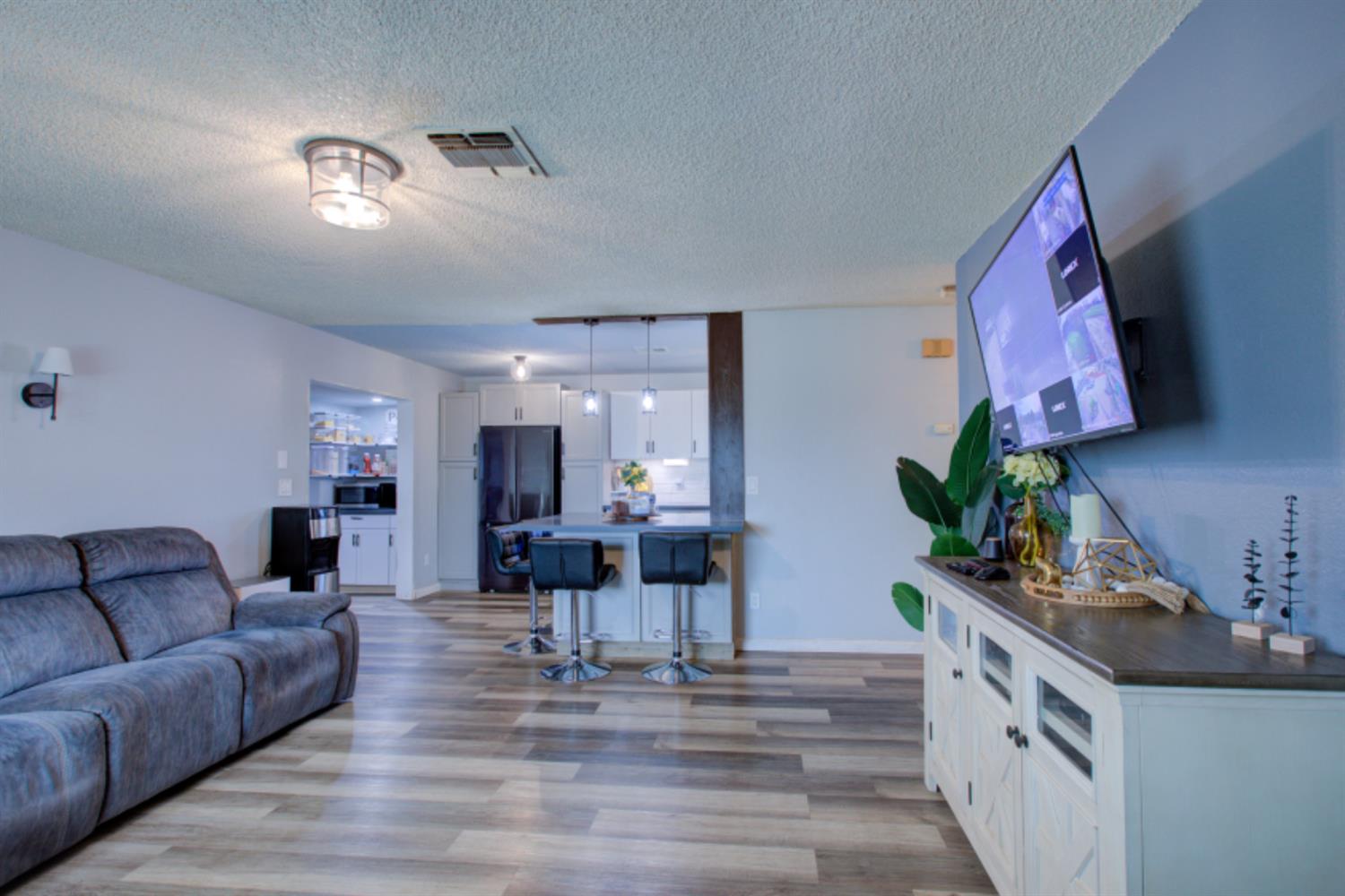7139 Center Street Winton, CA 95388 - Photo 8 of 36 a living room with furniture and a chandelier