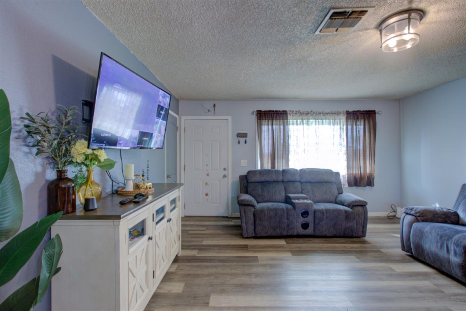7139 Center Street Winton, CA 95388 - Photo 10 of 36 a living room with furniture and a window