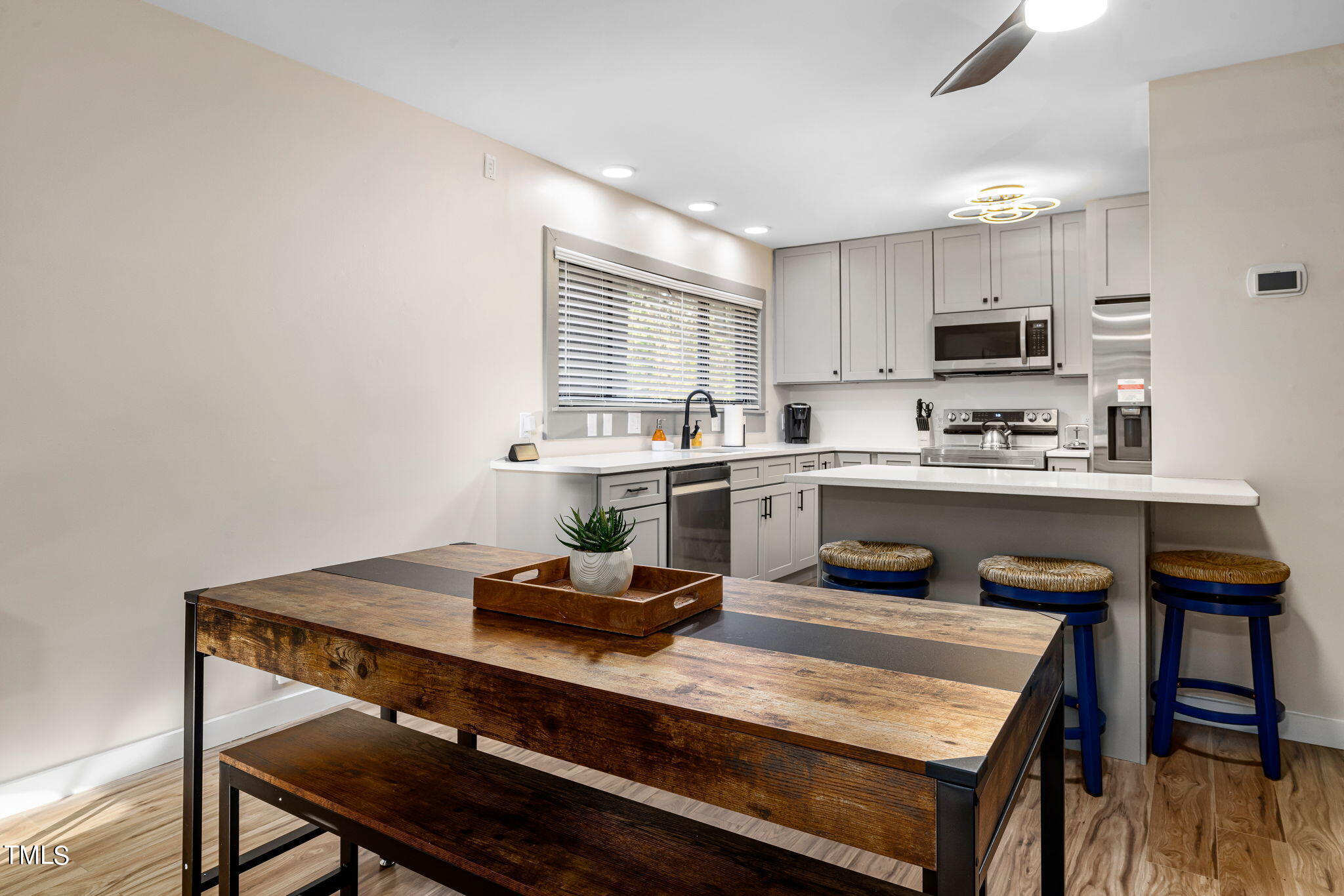 5020 Flint Ridge Place Raleigh, NC 27609 - Photo 8 of 30 a kitchen with a table and chairs in it