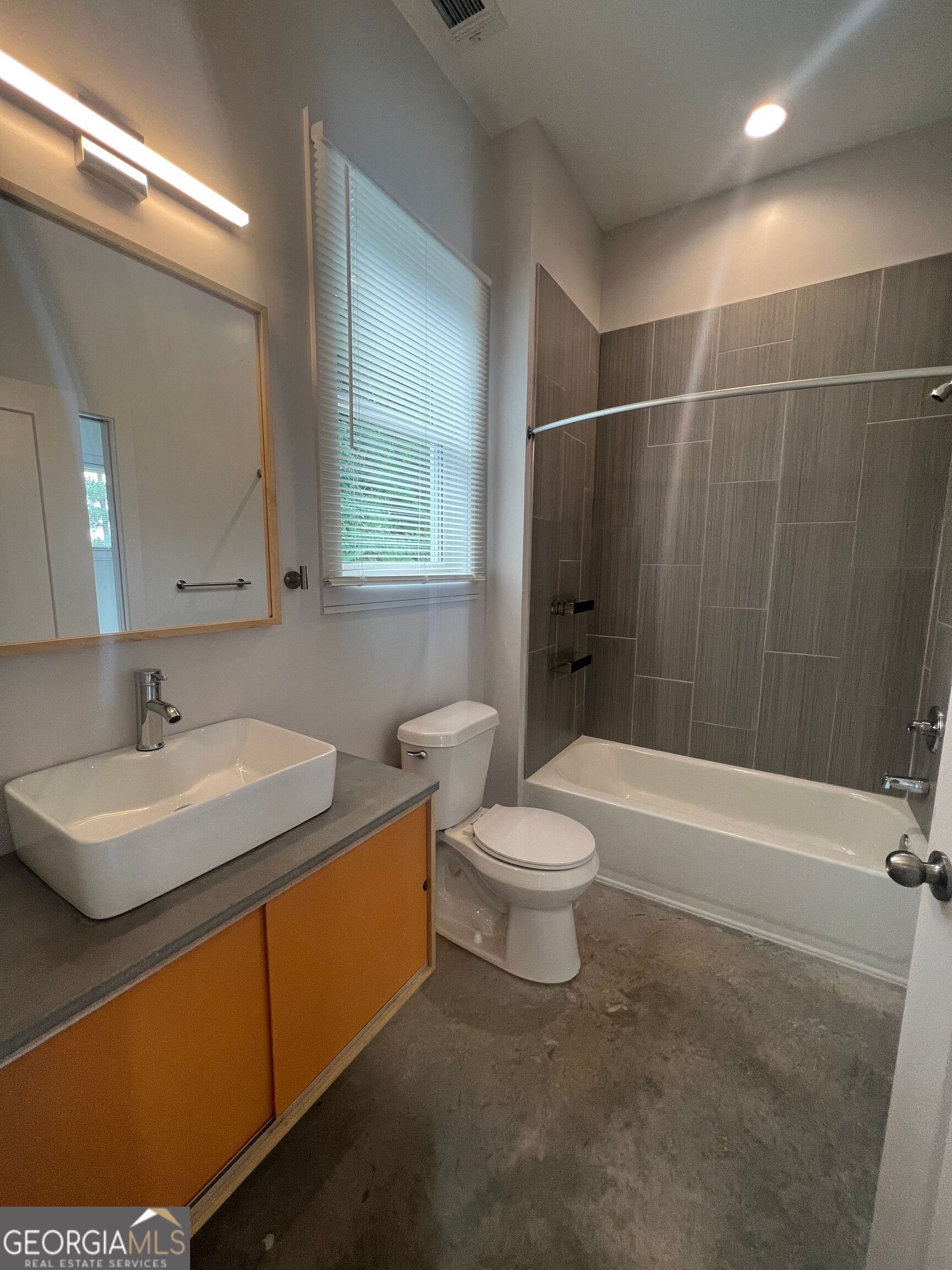 221 North Avenue Athens, GA 30601 - Photo 4 of 7 a bathroom with a sink a toilet and shower