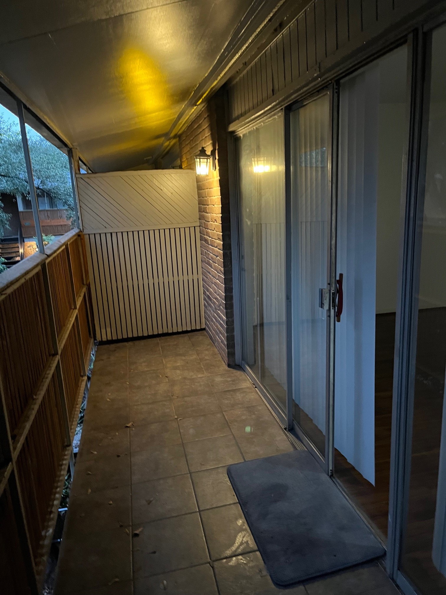 3938 West Alabama Street, Unit 12 Houston, TX 77027 - Photo 4 of 25 Private covered balcony with sliding glass door entry & outdoor seating space potential.
