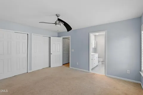 a view of empty room with ceiling fan