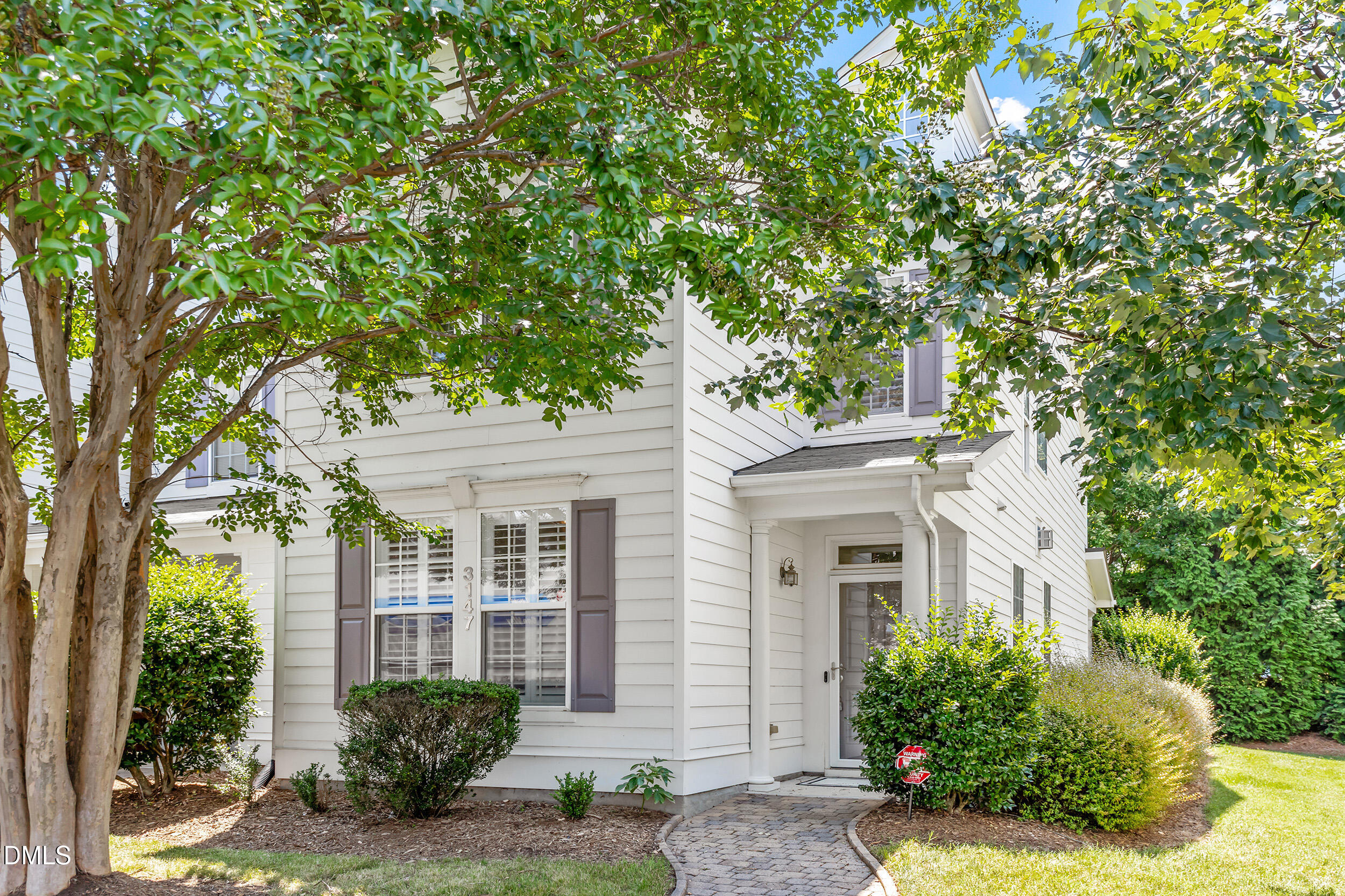 3147 Rapid Falls Road Cary, NC 27519 - Photo 30 of 34 a front view of a house with a yard garage and outdoor seating
