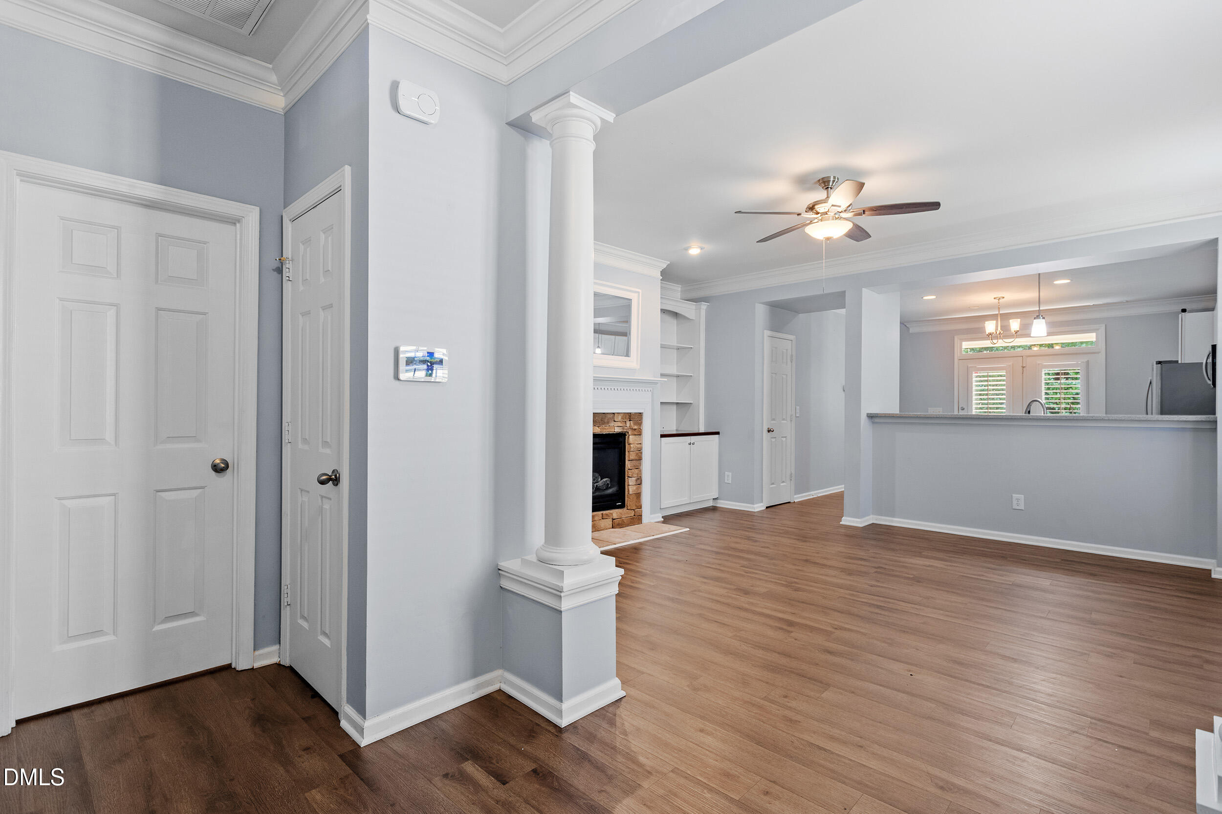 3147 Rapid Falls Road Cary, NC 27519 - Photo 6 of 34 a view of a livingroom with a fireplace wooden floor and cabinet