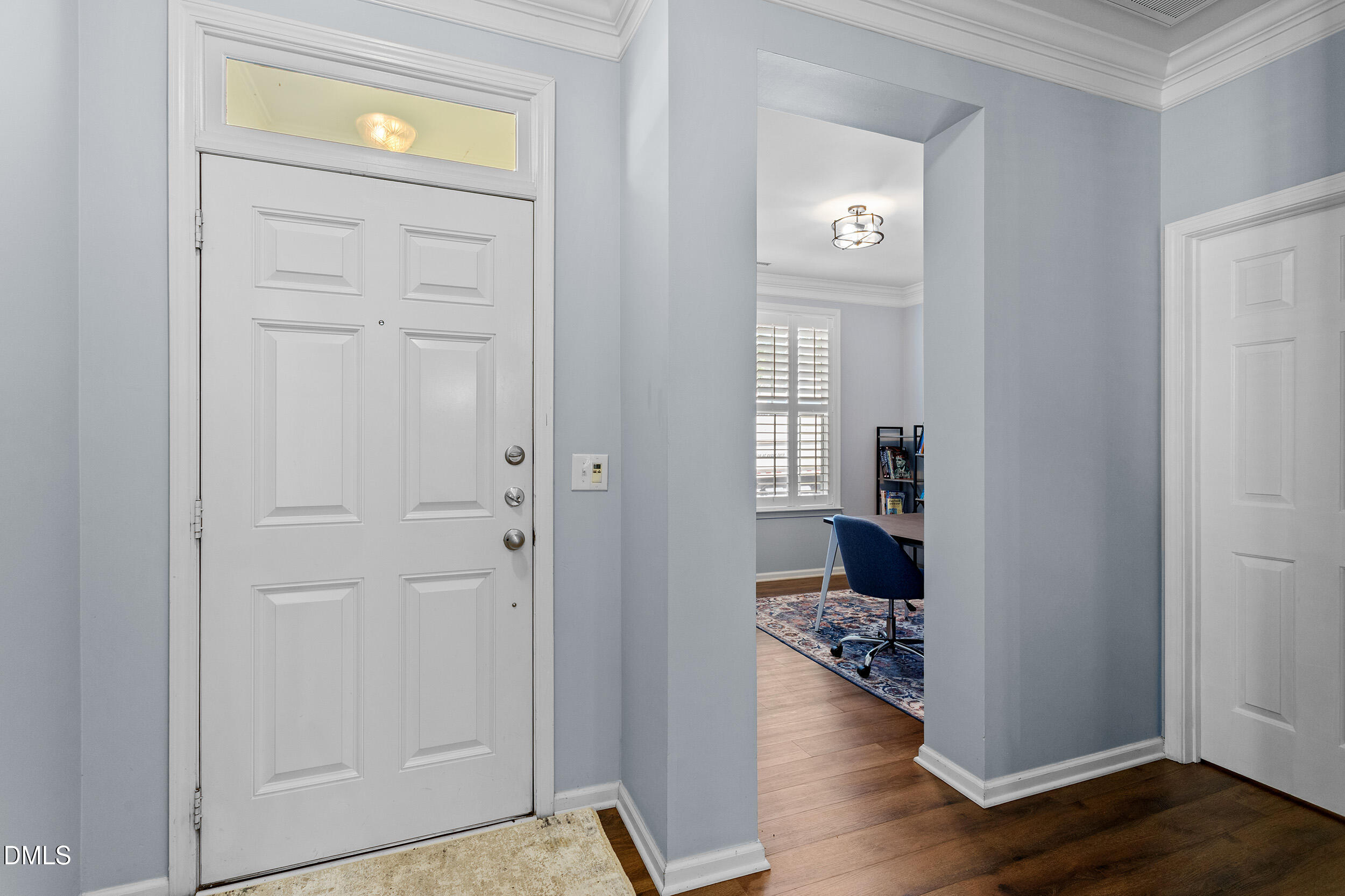 3147 Rapid Falls Road Cary, NC 27519 - Photo 10 of 34 a view of a hallway with wooden floor windows and kitchen view
