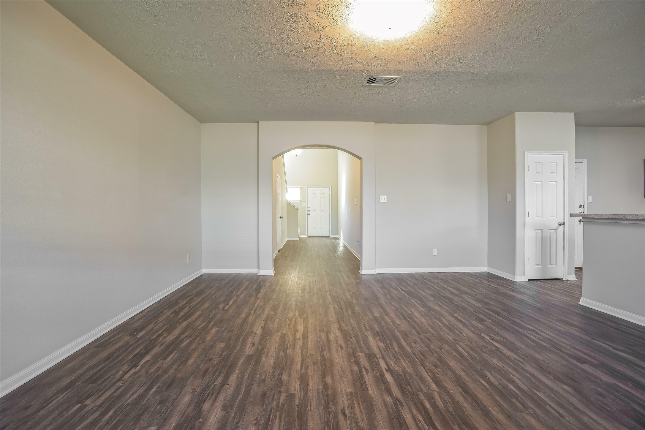 9718 Floria Court Houston, TX 77044 - Photo 5 of 14 wooden floor in an empty room with a window